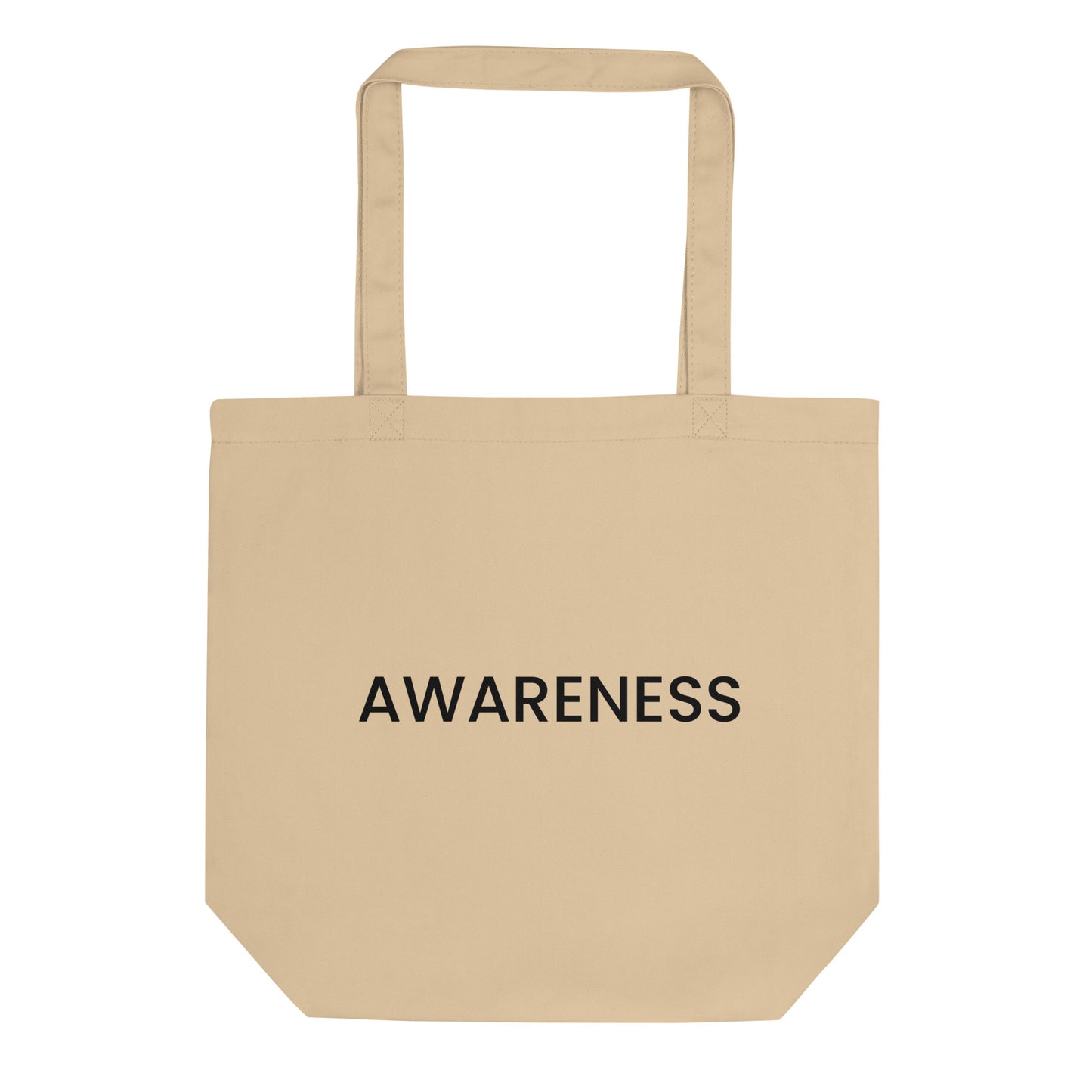 A light beige tote bag with the word "AWARENESS" printed on the front. The text is in a bold, black, sans-serif font, centered on one line, and is in all caps.