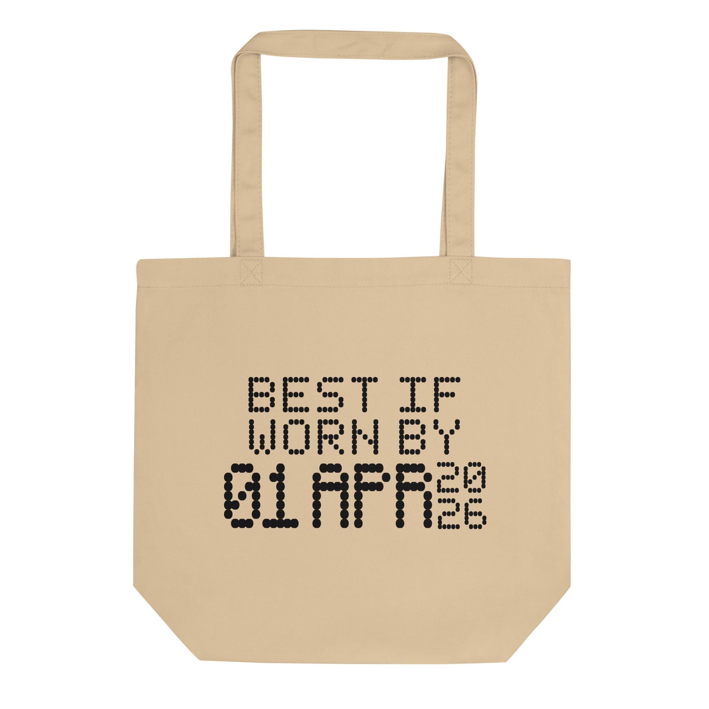 A minimalistic eco tote bag with the phrase “Best If Worn By 01 April 2026” printed in a bold, dot-matrix-style font. The design resembles an expiration date label, blending humor with clean, modern aesthetics.