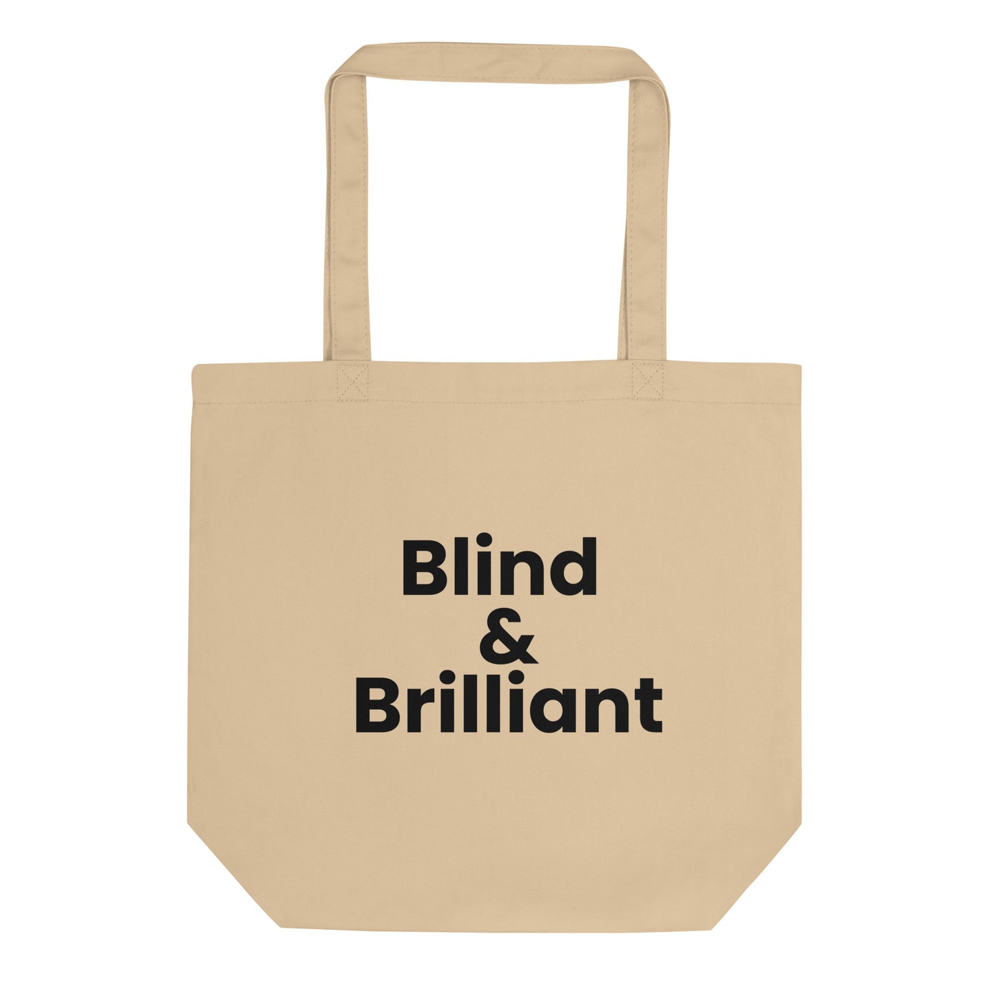 A light beige tote bag with the phrase "Blind & Brilliant" printed on the front. The text is in a bold, black, sans-serif font and is stacked on three lines.