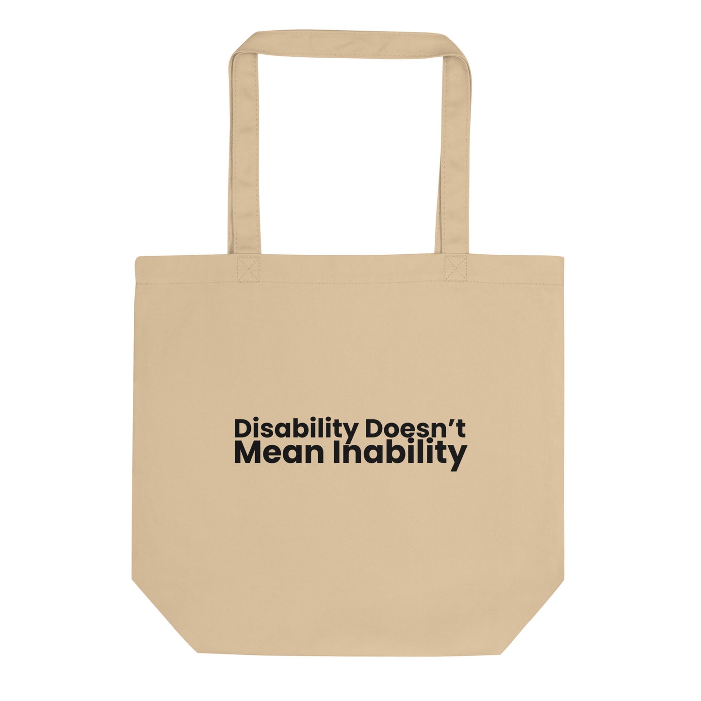 A light beige tote bag with the phrase "Disability Doesn't Mean Inability" printed on the front in a bold, black, sans-serif font. The text is stacked on two lines.