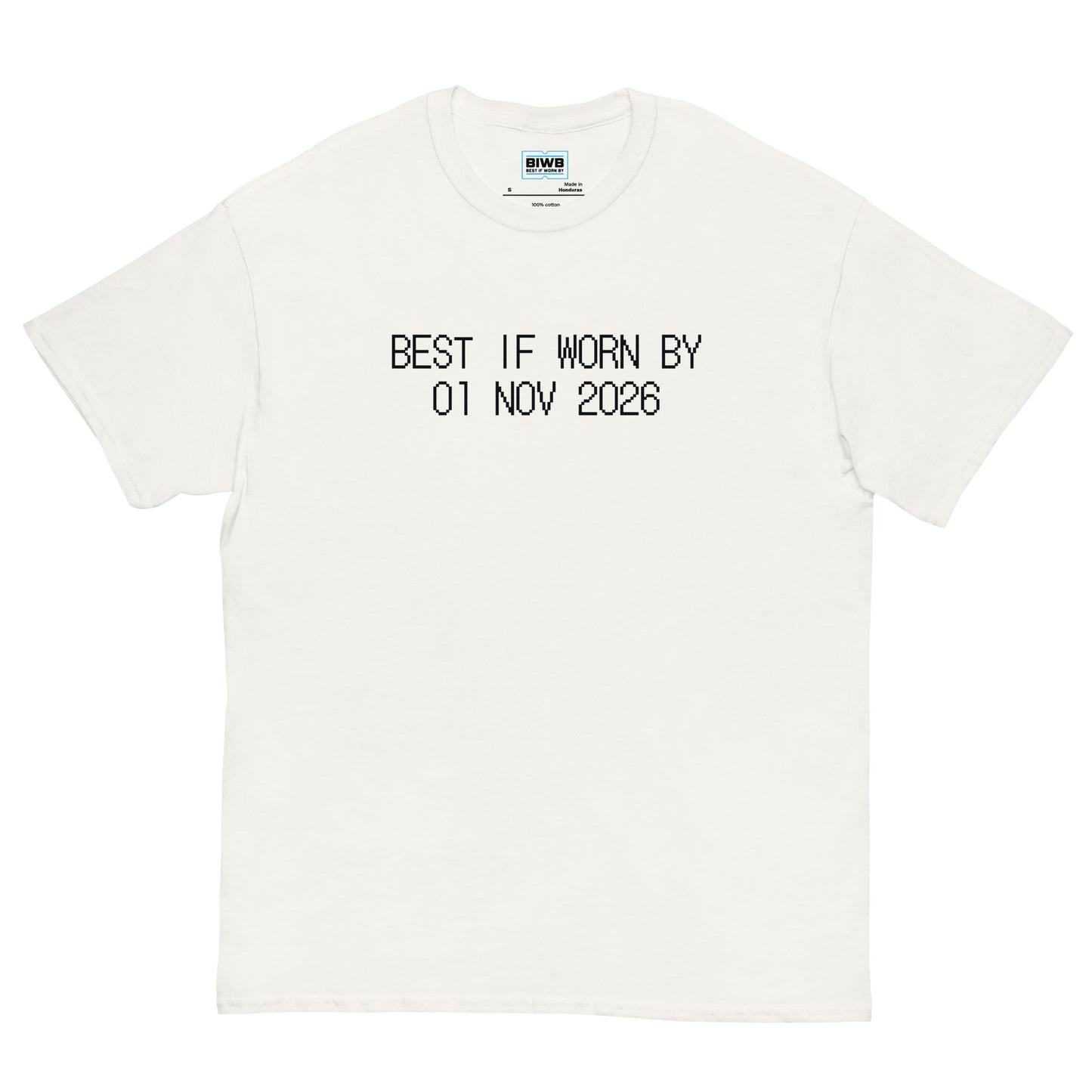Printed in black dot matrix font, “BEST IF WORN BY 01 NOV 2026” mimics a best-before label—offering a quiet reflection on life’s pace and presence.