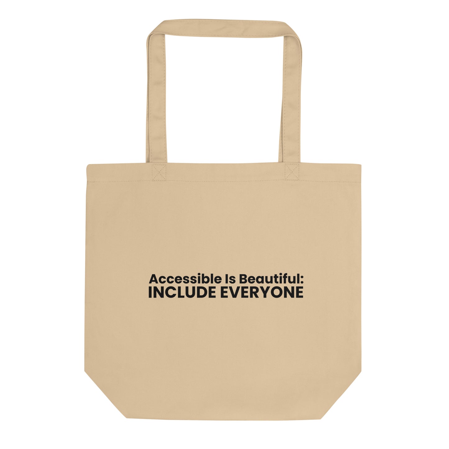 A light beige tote bag with the phrase "Accessible Is Beautiful: INCLUDE EVERYONE" printed on the front. The text is in a bold, black, sans-serif font and is stacked on two lines.