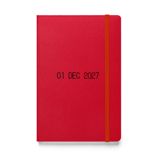 Hardcover journal with black dot matrix font reading “01 DEC 2027” on the cover. A closing note to record your year’s story and dream ahead.