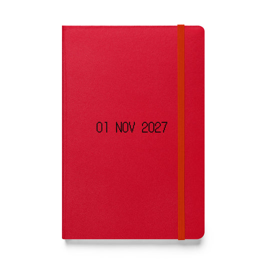 Hardcover journal with black dot matrix font reading “01 NOV 2027” on the cover. A reflection point, guiding gratitude and mindful expression.