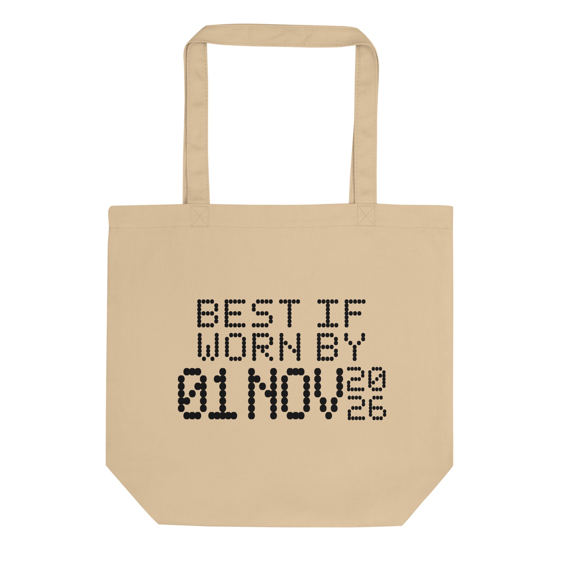 A minimalistic eco tote bag with the phrase “Best If Worn By 01 November 2026” printed in a bold, dot-matrix-style font. The design resembles an expiration date label, blending humor with clean, modern aesthetics.