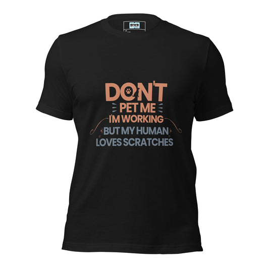 A bold, centered layout displays the phrase “DON’T PET ME I’M WORKING BUT MY HUMAN LOVES SCRATCHES” in stacked, all-caps sans-serif text. Warm orange and muted blue highlight different phrases. A paw print, guide dog silhouette, and small hearts add a playful yet clear tone, balancing humor with a message of respect for working service animals.