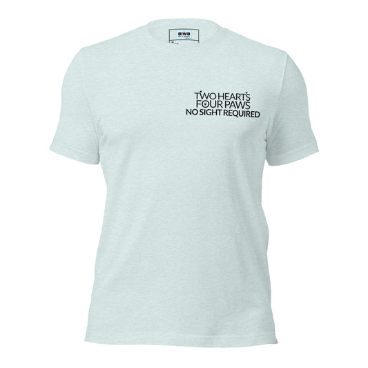 A centered typographic design features the phrase “TWO HEARTS FOUR PAWS NO SIGHT REQUIRED” in clean, bold sans-serif text. Small heart icons replace the apostrophes in “HEART’S,” and a subtle paw print appears in the letter “O” of “FOUR.” The layout conveys warmth, trust, and the deep connection between guide dogs and their humans.