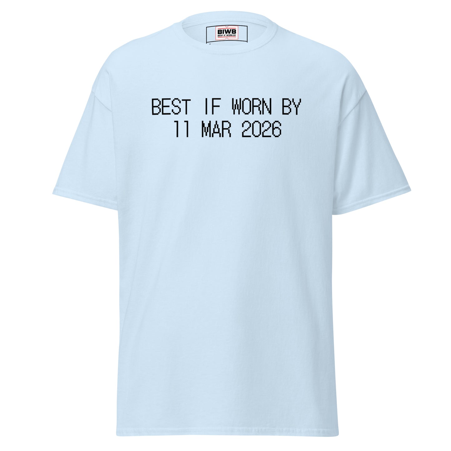 “BEST IF WORN BY 11 MAR 2026” printed in black dot matrix font captures industrial sharpness—reminding us to notice small, passing moments.