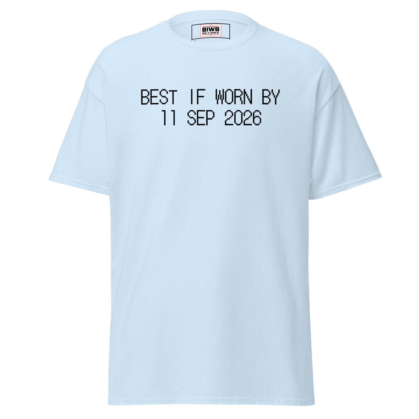 “BEST IF WORN BY 11 SEP 2026” printed in black dot matrix font—a day of remembrance in the U.S., loss etched deeper than ink.