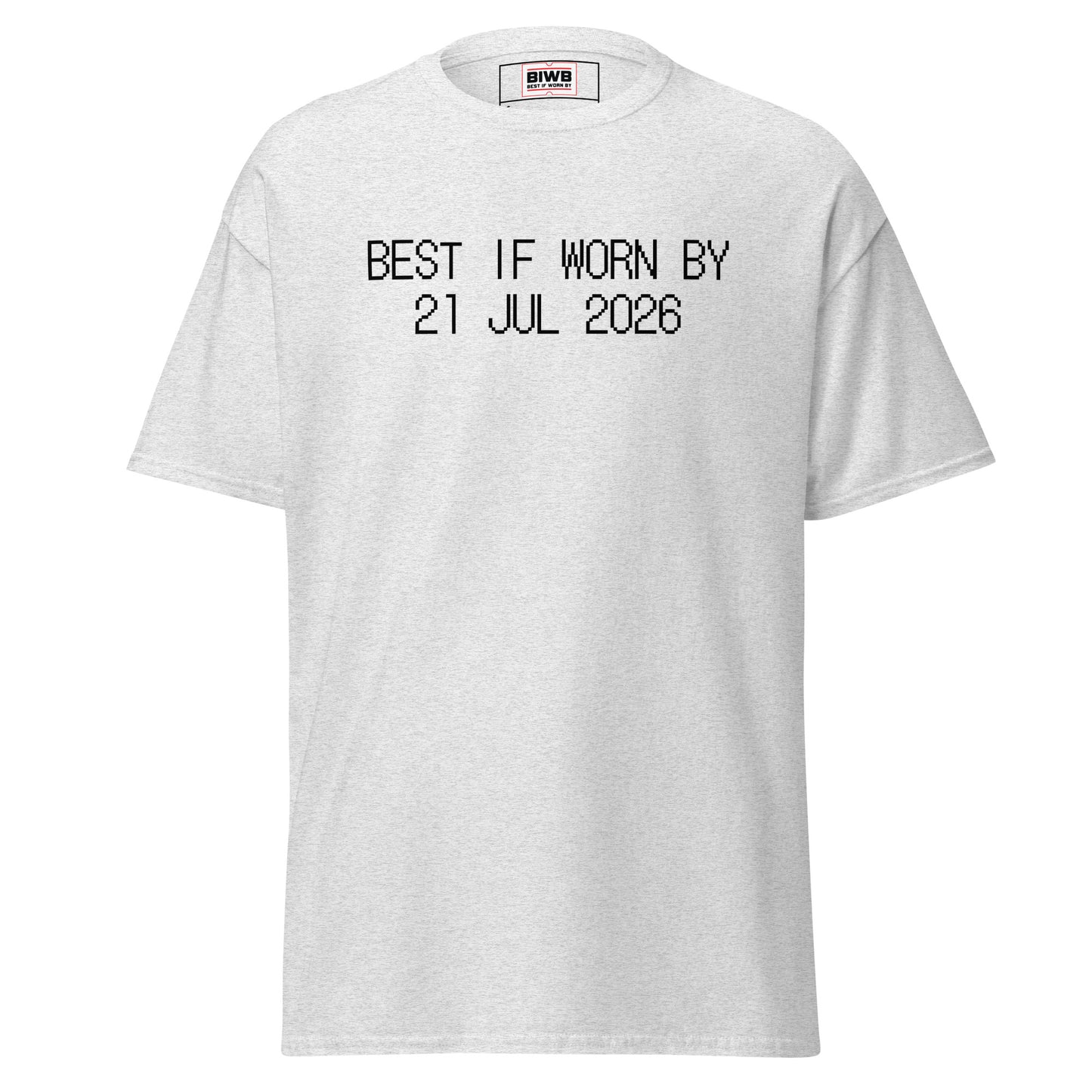 “BEST IF WORN BY 21 JUL 2026” printed in black dot matrix font—the dots hold quiet authority, declaring impermanence.