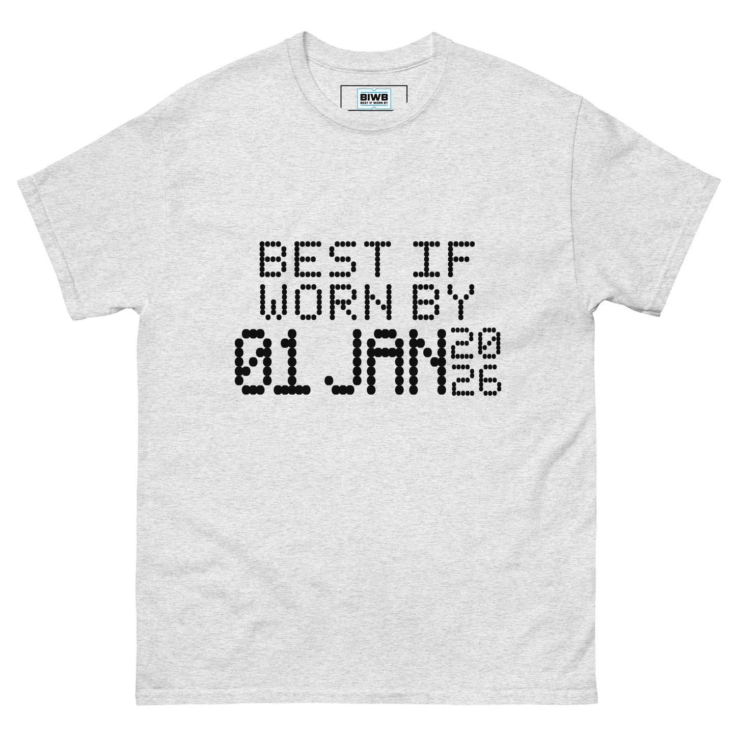 The phrase “BEST IF WORN BY 01 JAN 2026” appears in a black dot matrix font, styled like an expiration label. The minimalist typeface adds a touch of quiet humor and mindfulness about time and presence.