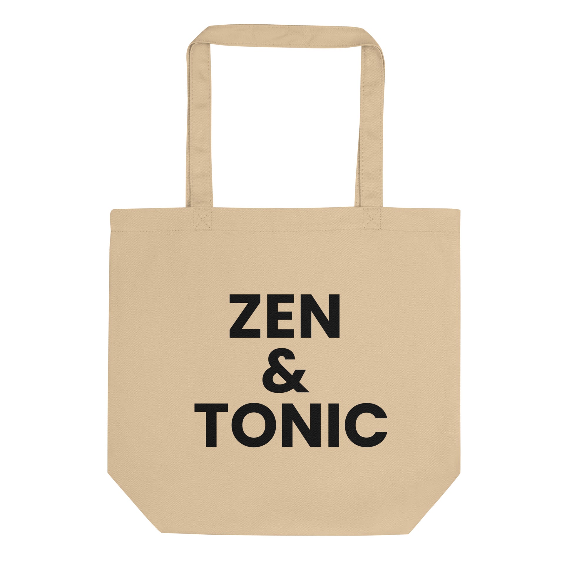 A light beige tote bag with the phrase "ZEN &amp; TONIC" printed on the front. The text is in a bold, black, sans-serif font and is stacked on three lines.